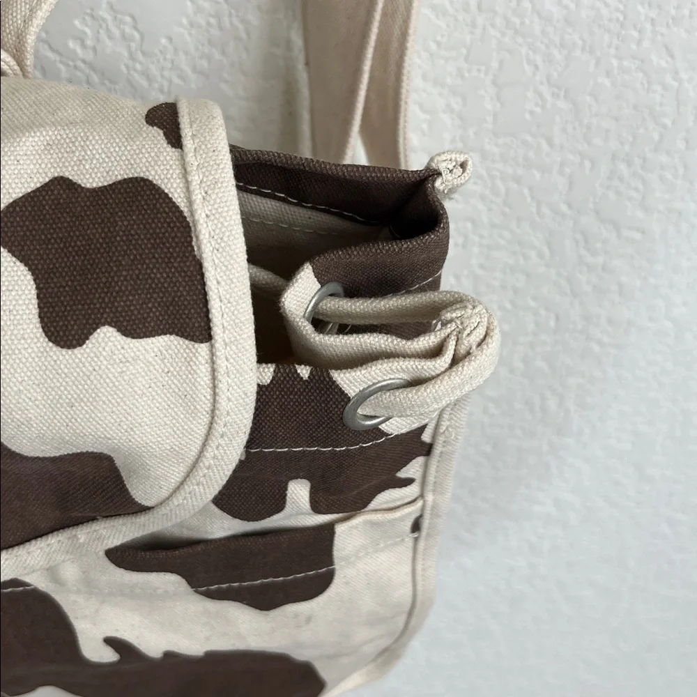 BAGGU Canvas Cow Print Backpack in Cream and Brown